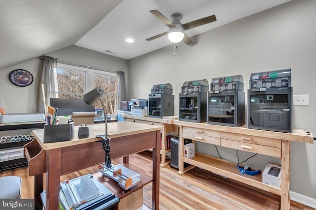 office area featuring ceiling fan, vaulted ceiling, and hardwood / wood-style flooring