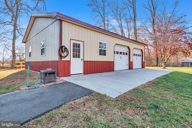 garage featuring a lawn