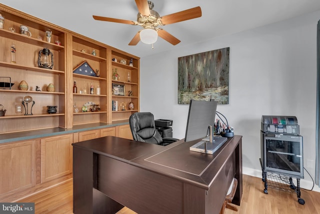 office featuring light hardwood / wood-style flooring and ceiling fan