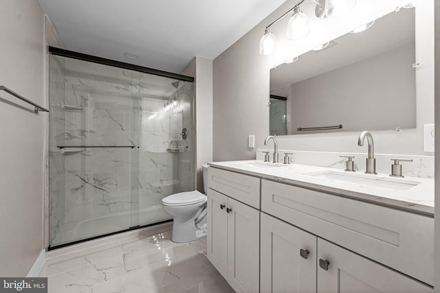 bathroom featuring vanity, toilet, and an enclosed shower