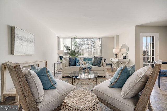 living room with parquet floors and a healthy amount of sunlight