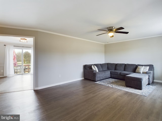 living room with dark hardwood / wood-style floors, ceiling fan, and crown molding