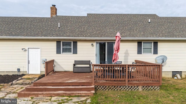 back of house featuring a wooden deck