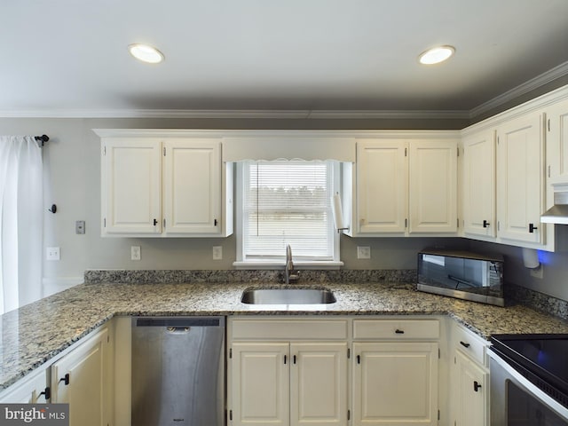 kitchen featuring white cabinets, sink, light stone countertops, ornamental molding, and stainless steel appliances