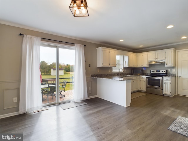 kitchen with stainless steel electric stove, dark hardwood / wood-style flooring, white cabinets, and dark stone counters