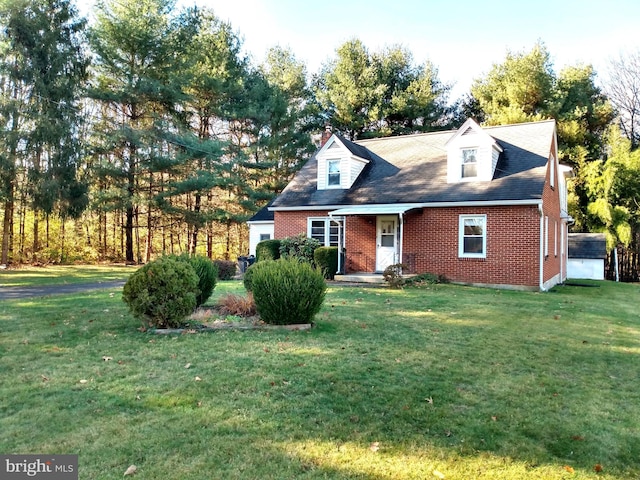 new england style home with a front lawn