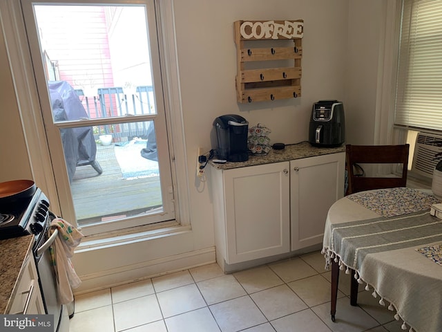 bedroom with light tile patterned floors