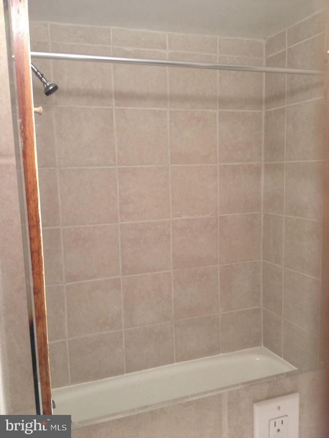 bathroom with a tile shower