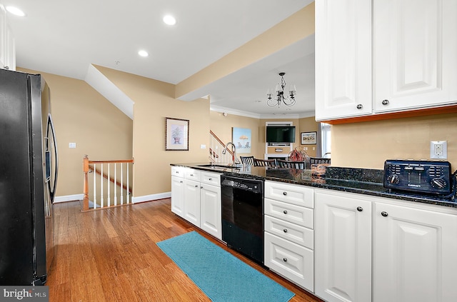 kitchen with stainless steel refrigerator with ice dispenser, ornamental molding, light hardwood / wood-style flooring, black dishwasher, and white cabinetry