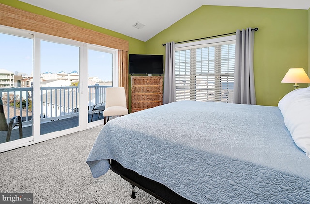 carpeted bedroom with access to outside and lofted ceiling