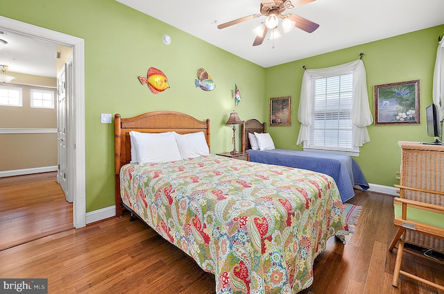 bedroom featuring ceiling fan and hardwood / wood-style floors