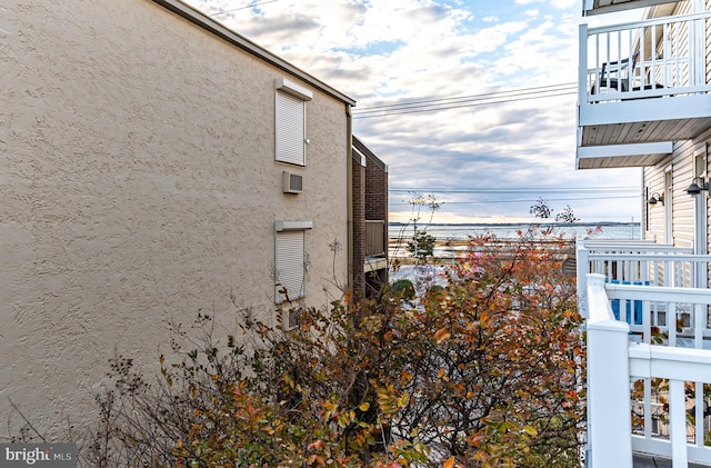 view of side of property featuring a balcony