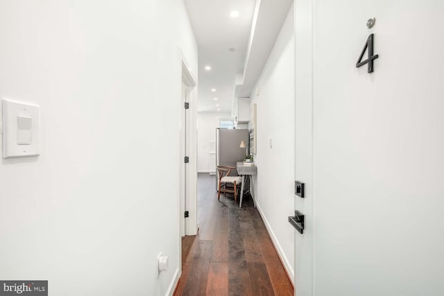 corridor featuring dark hardwood / wood-style flooring