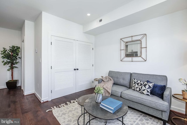 living room featuring dark hardwood / wood-style flooring