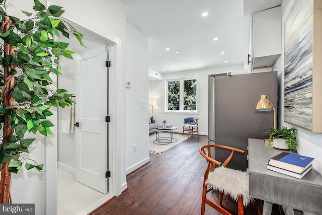 office with dark hardwood / wood-style floors