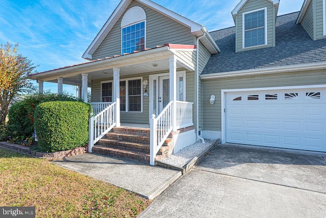 view of front of house featuring a porch and a garage