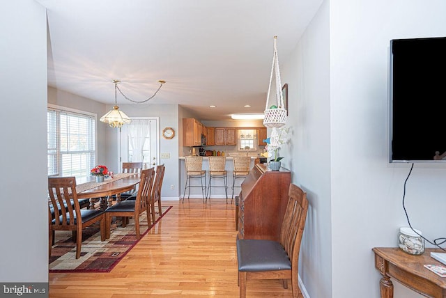 dining area featuring light wood-type flooring