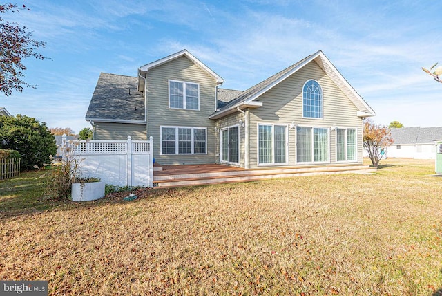 back of house featuring a yard