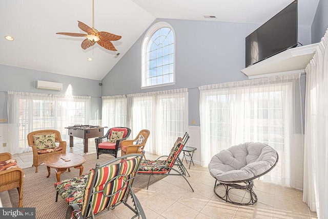 sunroom / solarium featuring ceiling fan, lofted ceiling, and a wall unit AC