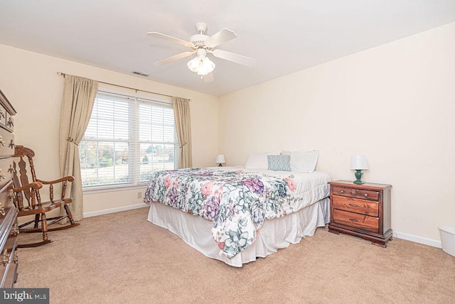 carpeted bedroom with ceiling fan