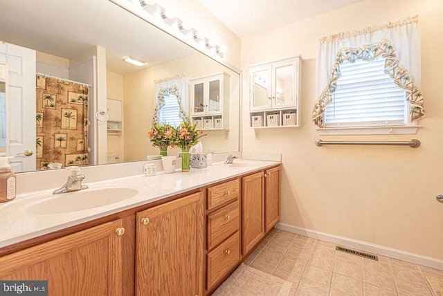 bathroom featuring vanity and tile patterned floors