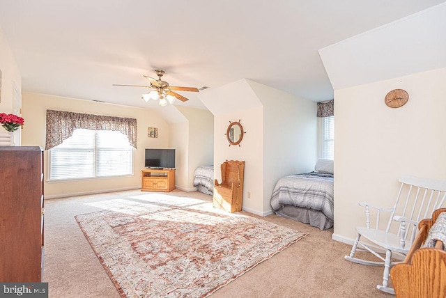 bedroom with ceiling fan, light colored carpet, and lofted ceiling