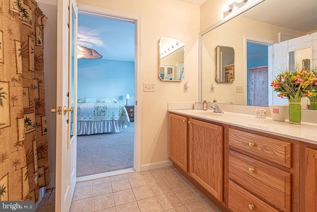 bathroom featuring tile patterned flooring and vanity