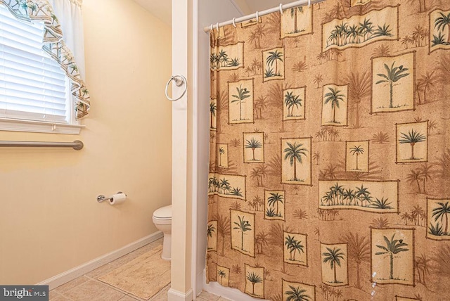 bathroom featuring tile patterned flooring and toilet