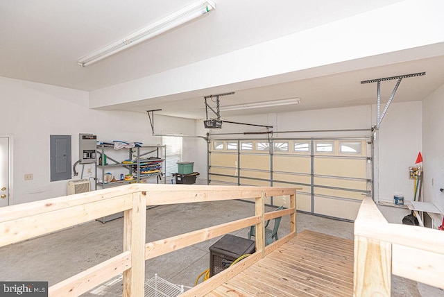 garage with electric panel and a garage door opener