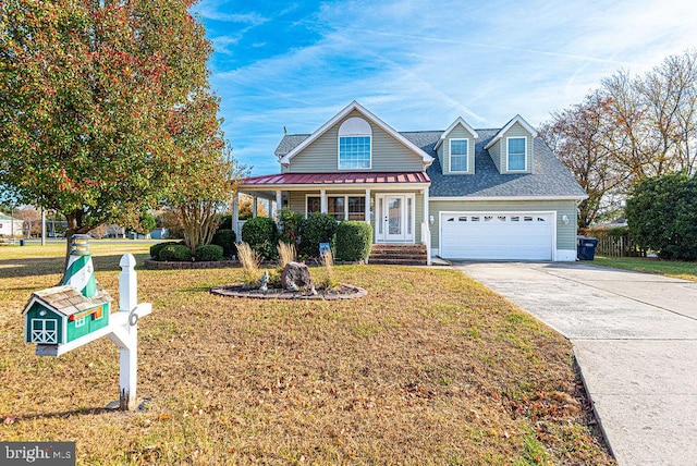 view of front of property featuring a garage, covered porch, and a front lawn