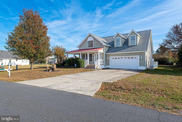 view of front facade featuring a front yard, a porch, and a garage