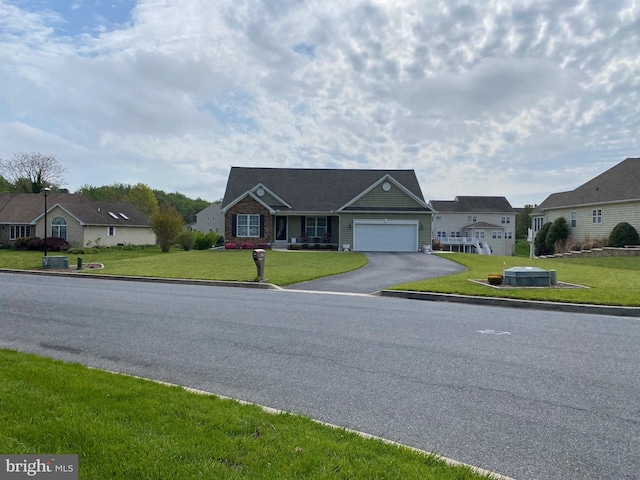 ranch-style home featuring a residential view, an attached garage, driveway, and a front yard