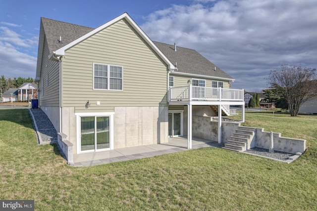 back of house with a yard, a patio, and a deck