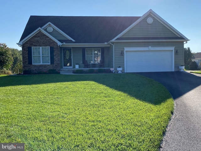 view of front of house with aphalt driveway, stone siding, a garage, and a front yard