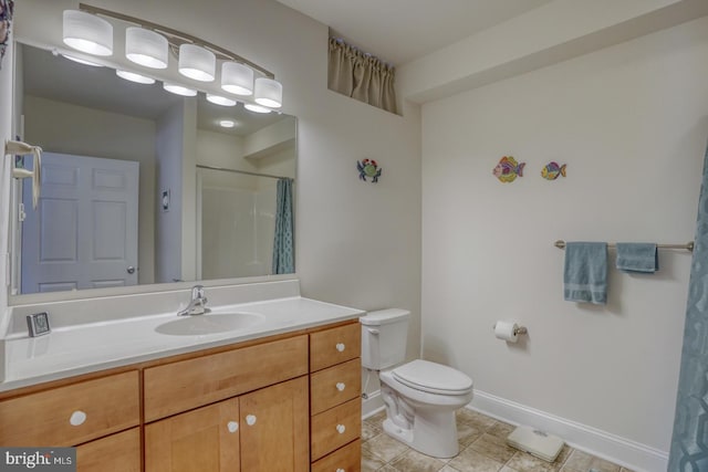 bathroom with tile patterned floors, vanity, curtained shower, and toilet