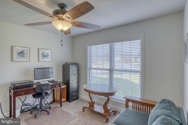 carpeted home office with ceiling fan