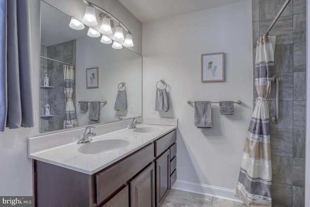 bathroom featuring a shower with curtain and vanity