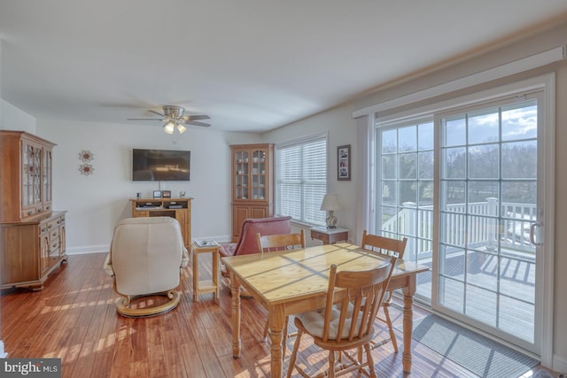 dining area with ceiling fan, a healthy amount of sunlight, and hardwood / wood-style flooring