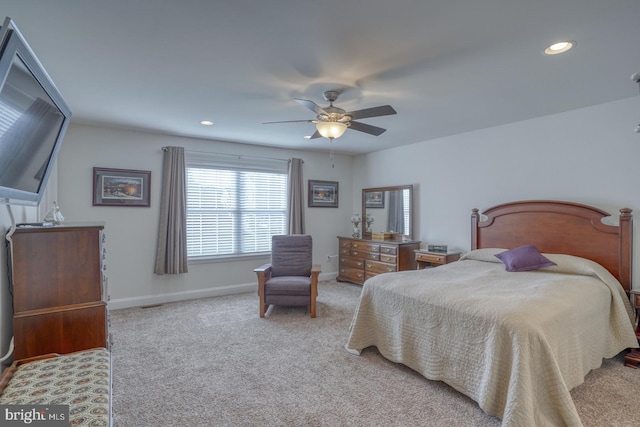 bedroom with light colored carpet and ceiling fan