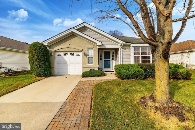 ranch-style house featuring a front yard and a garage