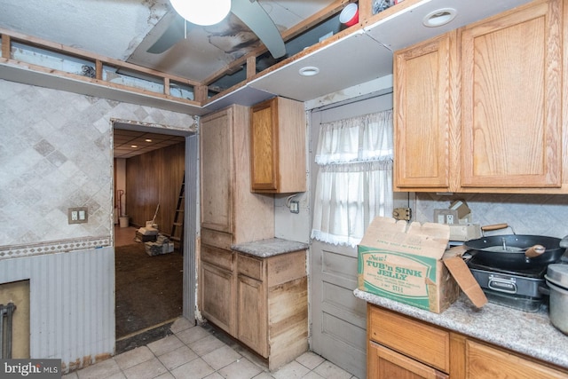 kitchen with ceiling fan and light tile patterned flooring