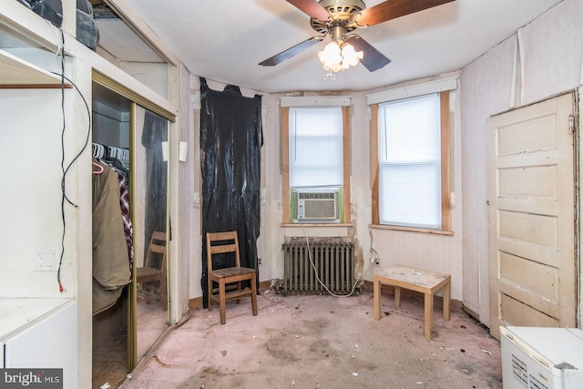 miscellaneous room with ceiling fan, radiator heating unit, and cooling unit