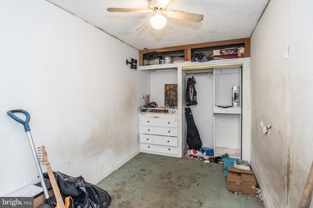 interior space featuring concrete flooring, a closet, and ceiling fan