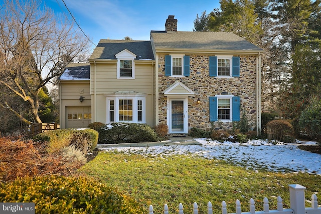 colonial house featuring a garage