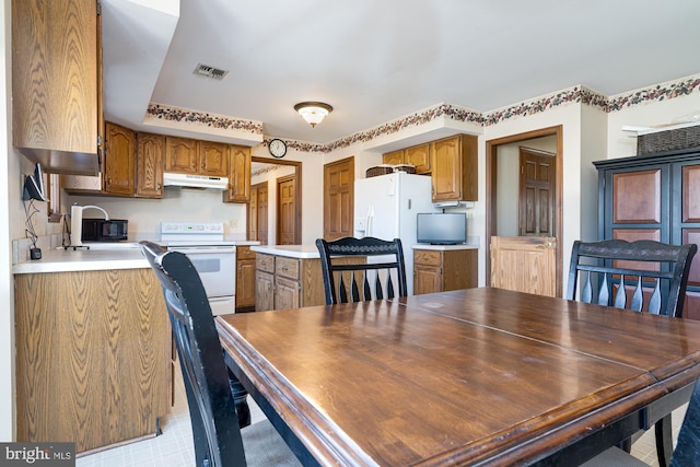 dining space featuring sink