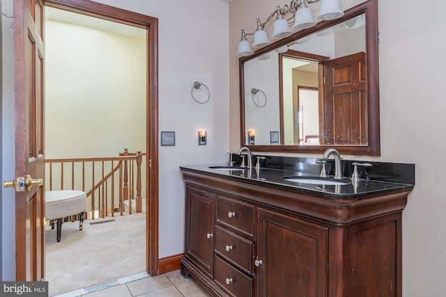 bathroom featuring tile patterned flooring and vanity