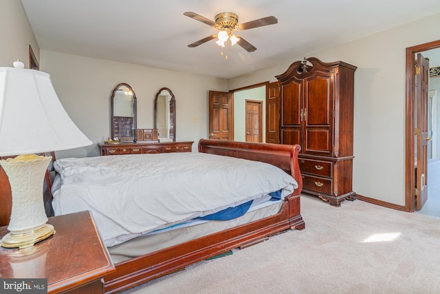 bedroom featuring ceiling fan and light colored carpet