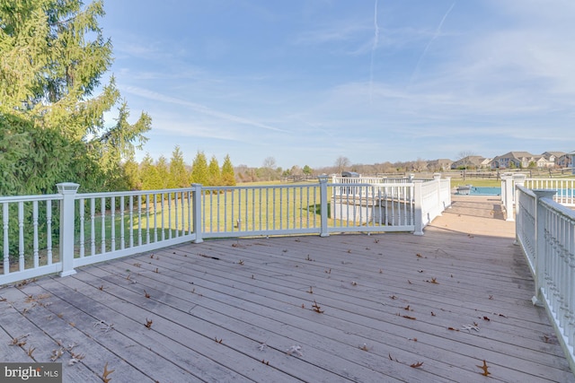 wooden deck featuring a water view