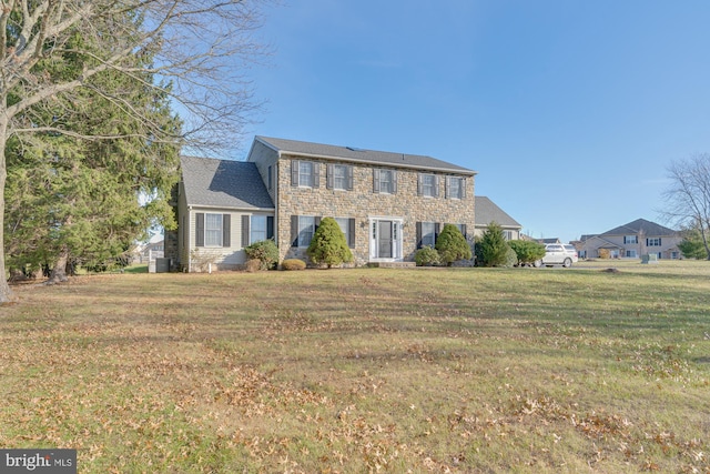 colonial home with a front yard