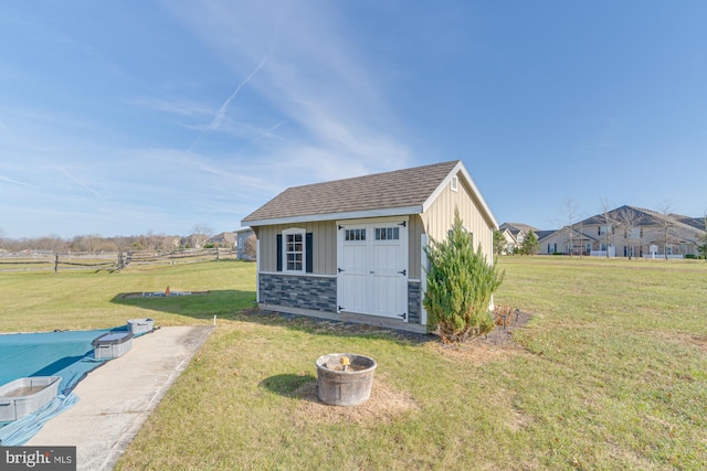 view of outbuilding with a lawn